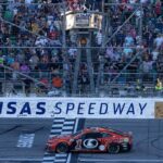 NASCAR Cup Series driver Ross Chastain (1) crosses the finish line to win the Hollywood Casino 400 at Kansas Speedway.