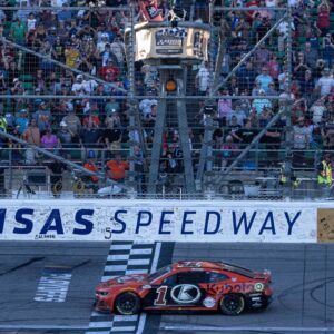 NASCAR Cup Series driver Ross Chastain (1) crosses the finish line to win the Hollywood Casino 400 at Kansas Speedway.