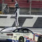 NASCAR Cup Series driver Ross Chastain (1) celebrates his come from behind win with a burnout and tossing a watermelon on the finish line during the Coca Cola 600 at Charlotte Motor Speedway.