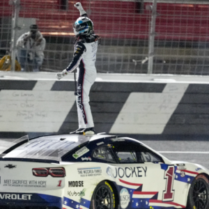 NASCAR Cup Series driver Ross Chastain (1) celebrates his come from behind win with a burnout and tossing a watermelon on the finish line during the Coca Cola 600 at Charlotte Motor Speedway.