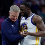 Golden State Warriors forward Draymond Green (23) talks with head coach Steve Kerr during the fourth quarter against the Sacramento Kings at Golden 1 Center.
