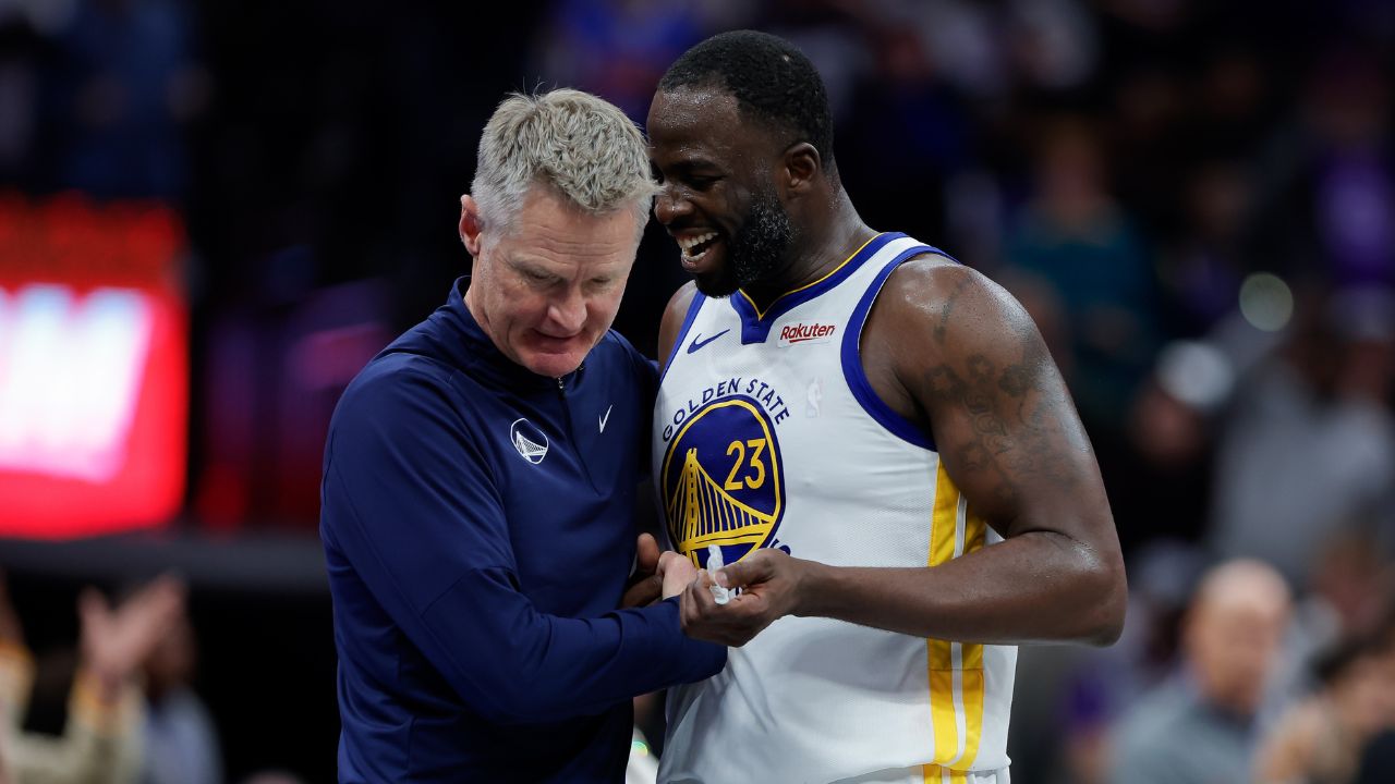 Golden State Warriors forward Draymond Green (23) talks with head coach Steve Kerr during the fourth quarter against the Sacramento Kings at Golden 1 Center.