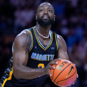 Former Marquette Golden Eagles player Dwyane Wade shoots during a timeout during the first half of the game against the Providence Friars at Fiserv Forum.