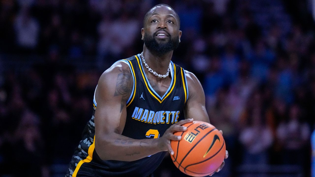 Former Marquette Golden Eagles player Dwyane Wade shoots during a timeout during the first half of the game against the Providence Friars at Fiserv Forum.