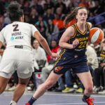 Indiana Fever guard Caitlin Clark (22) dribbles against Atlanta Dream guard Te-Hina Paopao (2) during the second half at Gateway Center Arena @ College Park.