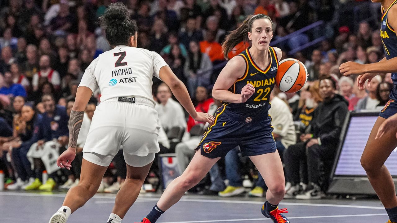 Indiana Fever guard Caitlin Clark (22) dribbles against Atlanta Dream guard Te-Hina Paopao (2) during the second half at Gateway Center Arena @ College Park.