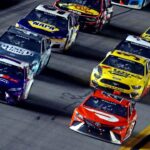 NASCAR Cup Series driver Denny Hamlin (11) and NASCAR Cup Series driver Bubba Wallace (23) lead the field during the Daytona 500 at Daytona International Speedway.