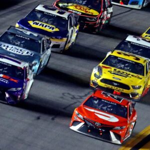 NASCAR Cup Series driver Denny Hamlin (11) and NASCAR Cup Series driver Bubba Wallace (23) lead the field during the Daytona 500 at Daytona International Speedway.