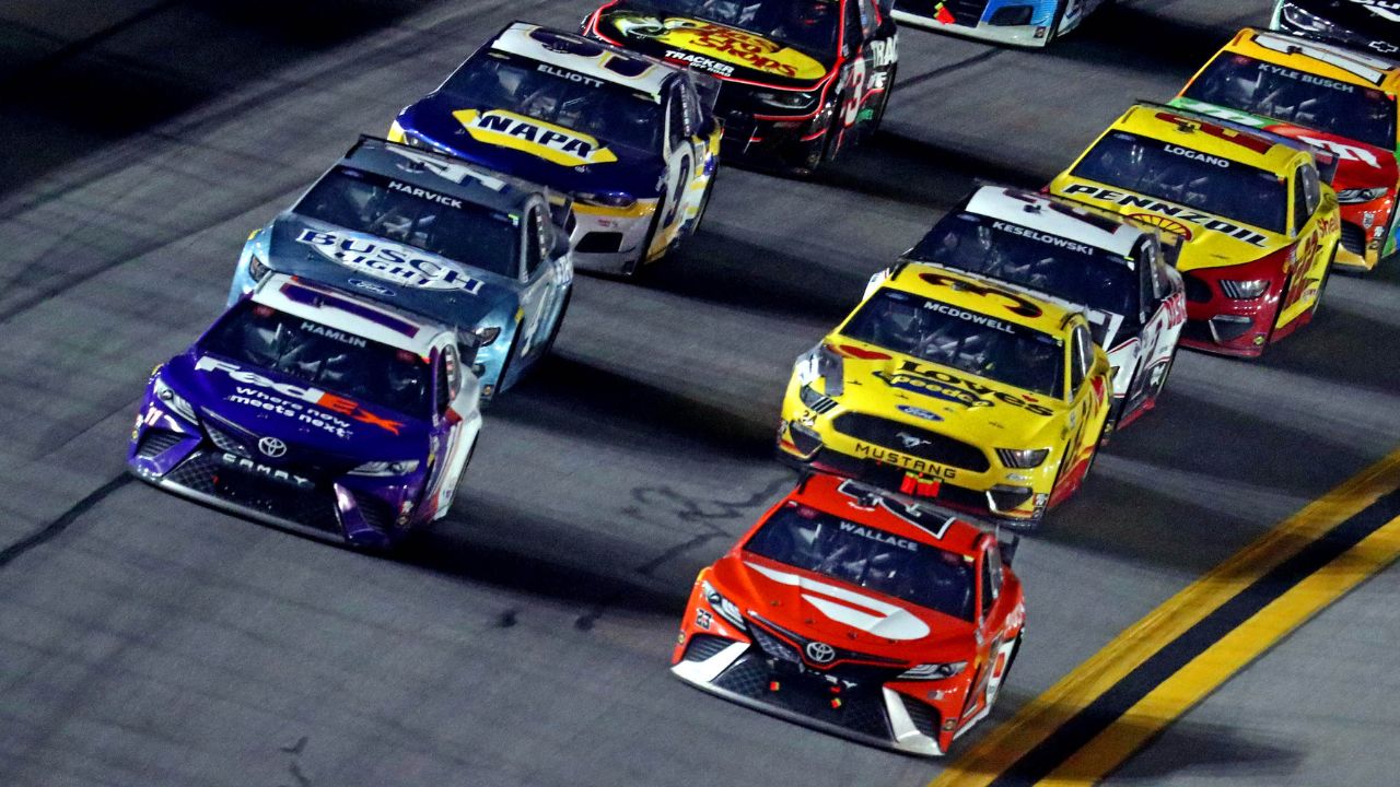NASCAR Cup Series driver Denny Hamlin (11) and NASCAR Cup Series driver Bubba Wallace (23) lead the field during the Daytona 500 at Daytona International Speedway.