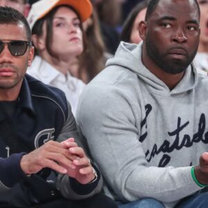 New York Giants quarterback Russell Wilson (l) and former NFL defensive end Justin Tuck (r) watch game five of first round for the 2025 NBA Playoffs between the Detroit Pistons and the New York Knicks at Madison Square Garden.