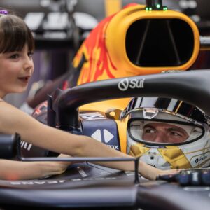 Max Verstappen of the Netherlands and Oracle Red Bull Racing and Penelope of Kelly Piquet™s daughter in the garage during the 2024 Formula One Abu Dhabi Grand Prix