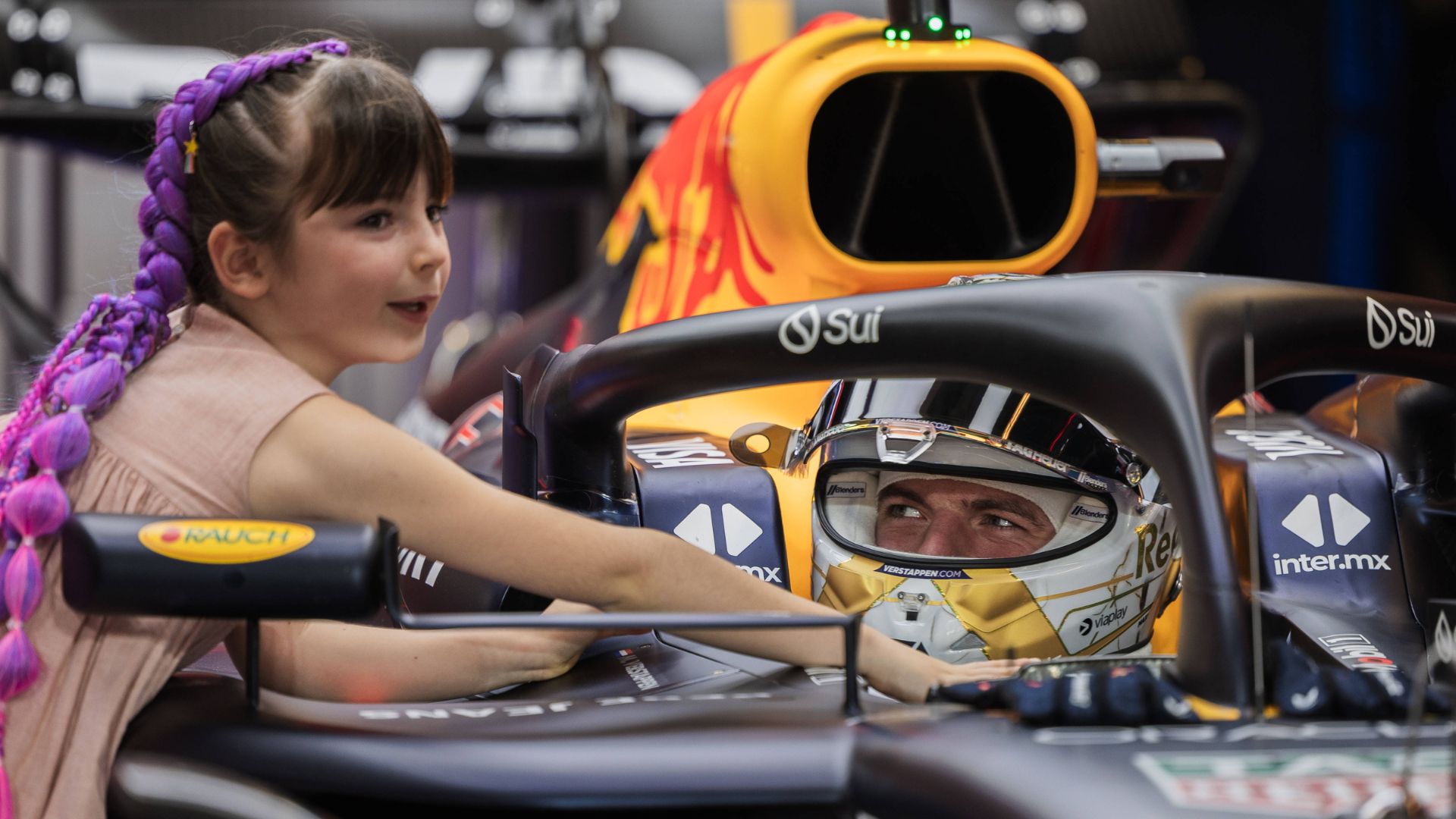 Max Verstappen of the Netherlands and Oracle Red Bull Racing and Penelope of Kelly Piquet™s daughter in the garage during the 2024 Formula One Abu Dhabi Grand Prix