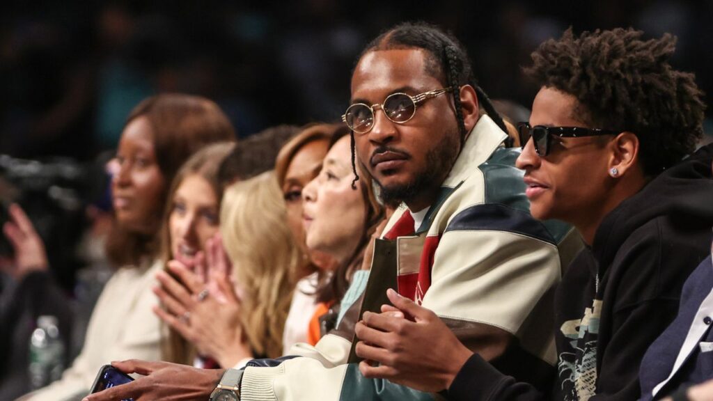 Former NBA forward Carmelo Anthony and his son Kyian Anthony during game two of the 2024 WNBA Semi-finals at Barclays Center.