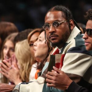 Former NBA forward Carmelo Anthony and his son Kyian Anthony during game two of the 2024 WNBA Semi-finals at Barclays Center.