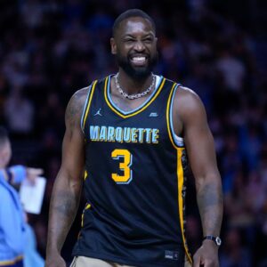 Feb 25, 2025; Milwaukee, Wisconsin, USA; Former Marquette Golden Eagles player Dwyane Wade smiles timeout during the first half of the game against the Providence Friars at Fiserv Forum. Mandatory Credit: Jeff Hanisch-Imagn Images