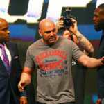 UFC president Dana White (center) separates fighter Jon Jones (right) from Daniel Cormier during a press conference prior to weigh-ins for UFC 196 at MGM Grand Garden Arena.