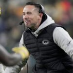 Green Bay Packers head coach Matt LaFleur celebrates a touchdown by running back Chris Brooks during the second quarter of their game against the New Orleans at Lambeau Field.