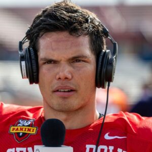 National team quarterback Dillon Gabriel of Oregon (8) talks with media members after Senior Bowl practice at Hancock Whitney Stadium.