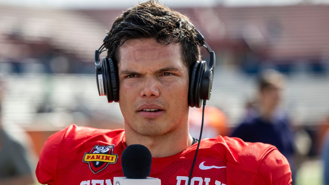 National team quarterback Dillon Gabriel of Oregon (8) talks with media members after Senior Bowl practice at Hancock Whitney Stadium.