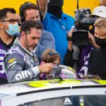 NASCAR driver Jimmie Johnson climbs from his car following the NASCAR Cup Series Championship at Phoenix Raceway.