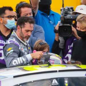 NASCAR driver Jimmie Johnson climbs from his car following the NASCAR Cup Series Championship at Phoenix Raceway.