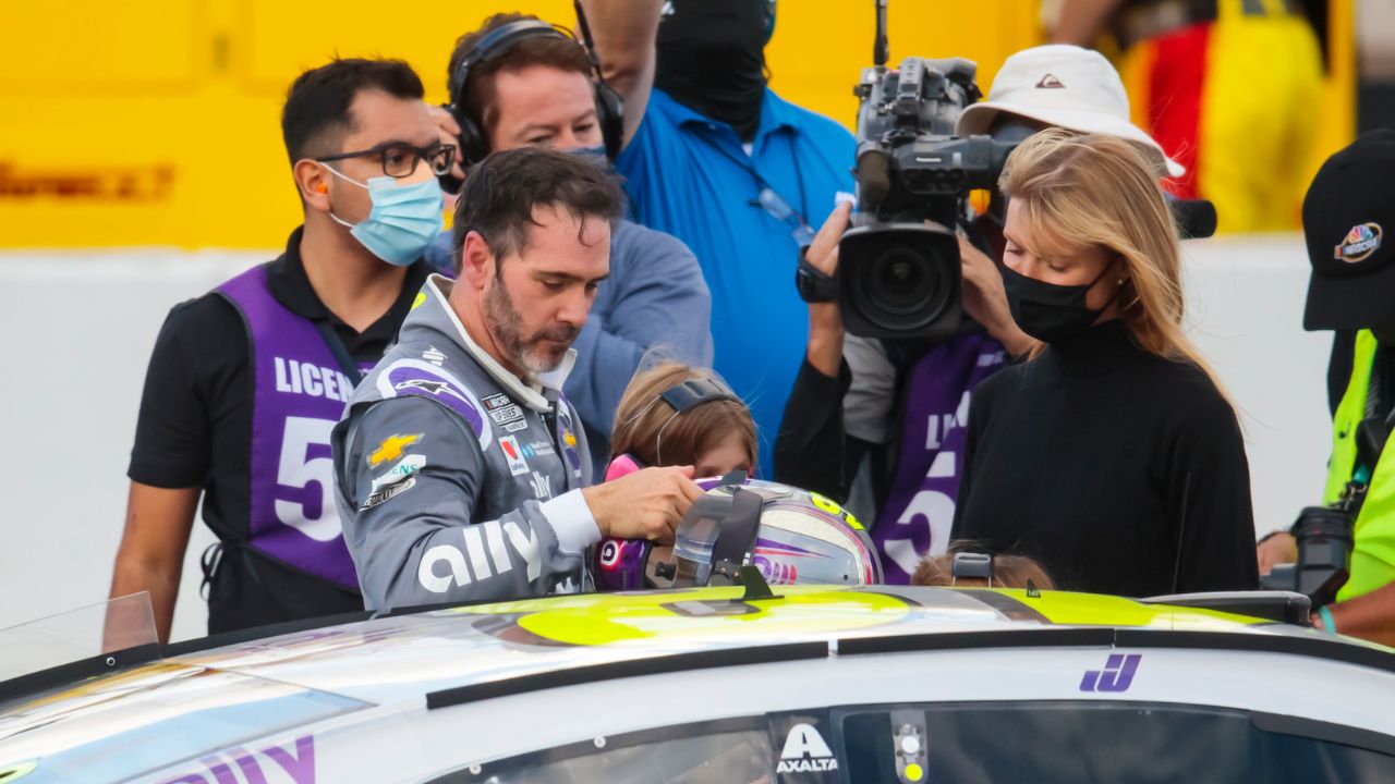NASCAR driver Jimmie Johnson climbs from his car following the NASCAR Cup Series Championship at Phoenix Raceway.