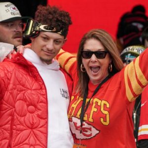 Kansas City Chiefs quarterback Patrick Mahomes (15) celebrates with his mother Randi Martin during the Kansas City Chiefs Super Bowl parade.
