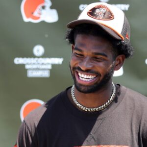 Cleveland Browns quarterback Shedeur Sanders (12) jokes about his signing bonus during a press conference before day two of NFL rookie minicamp at the Cleveland Browns training facility on Saturday, May 10, 2025, in Berea, Ohio.