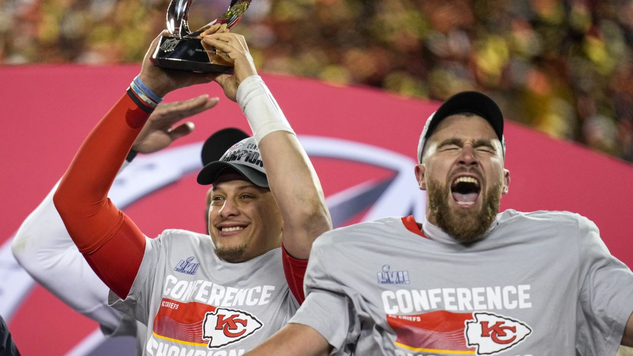 Kansas City Chiefs quarterback Patrick Mahomes (15) raises the Lamar Hunt Trophy with tight end Travis Kelce (87) after the AFC championship NFL game between the Cincinnati Bengals and the Kansas City Chiefs on Jan. 29, 2023, at Arrowhead Stadium in Kansas City.