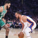 New York Knicks guard Jalen Brunson (11) looks to drive past Boston Celtics forward Jayson Tatum (0) in the first quarter at Madison Square Garden.