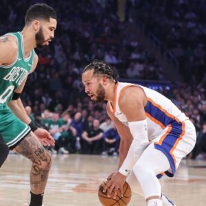 New York Knicks guard Jalen Brunson (11) looks to drive past Boston Celtics forward Jayson Tatum (0) in the first quarter at Madison Square Garden.