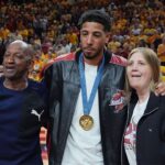 Former Iowa State and Indiana Packer guard Tyrese Haliburton holds his parents John and Brenda Haliburton as the unveiling his Olympic 24 gold made banner during the halftime of Cyclones and Wildcats men’s basketball showdown at Hilton Coliseum on Saturday March 1, 2025 in Ames, Iowa.