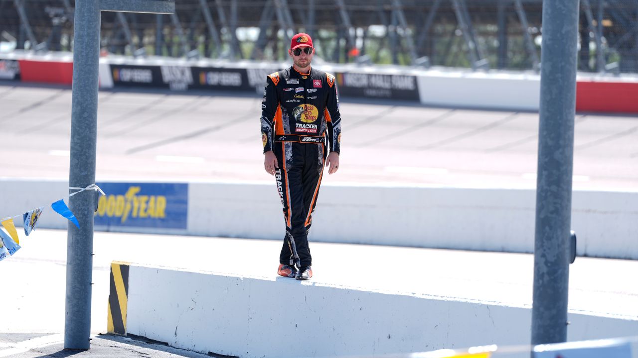 NASCAR Cup Series driver Chase Briscoe (19) poses on the wall for his social media person at Darlington Raceway.