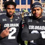 Nov 29, 2024; Boulder, Colorado, USA; Colorado Buffaloes quarterback Shedeur Sanders (2) and safety Shilo Sanders (21) before the game against the Oklahoma State Cowboys at Folsom Field.
