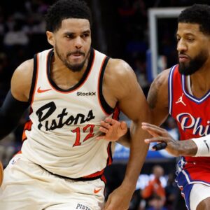 Detroit Pistons forward Tobias Harris (12) dribbles defended by Philadelphia 76ers forward Paul George (8) in the second half at Little Caesars Arena.