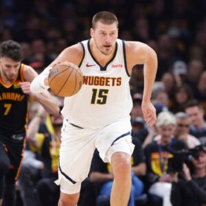 Denver Nuggets center Nikola Jokic (15) dribbles against the Oklahoma City Thunder during the second quarter during game one of the second round for the 2025 NBA Playoffs at Paycom Center.