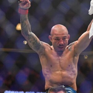 Jose Aldo (red gloves) reacts after a fight with Aiemann Zahabi (not pictured) during UFC 315 at Bell Centre.