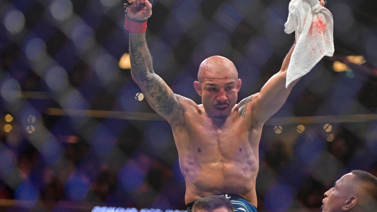 Jose Aldo (red gloves) reacts after a fight with Aiemann Zahabi (not pictured) during UFC 315 at Bell Centre.