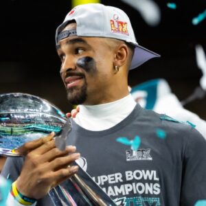 Feb 9, 2025; New Orleans, LA, USA; Philadelphia Eagles quarterback Jalen Hurts (left) and head coach Nick Sirianni celebrate with the Vince Lombardi Trophy after defeating the Kansas City Chiefs during Super Bowl LIX at Ceasars Superdome.