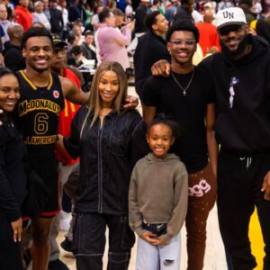 West guard Bronny James (6) poses for a family photo with grandmother Gloria Marie James, mother Savannah James , brother Bryce Maximus James, sister Zhuri Nova James and father LeBron James following the McDonald's All American Boy's high school basketball game at Toyota Center.