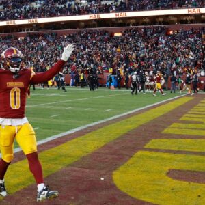 Washington Commanders cornerback Mike Sainristil (0) celebrates after the Commanders' game against the Philadelphia Eagles at Northwest Stadium.