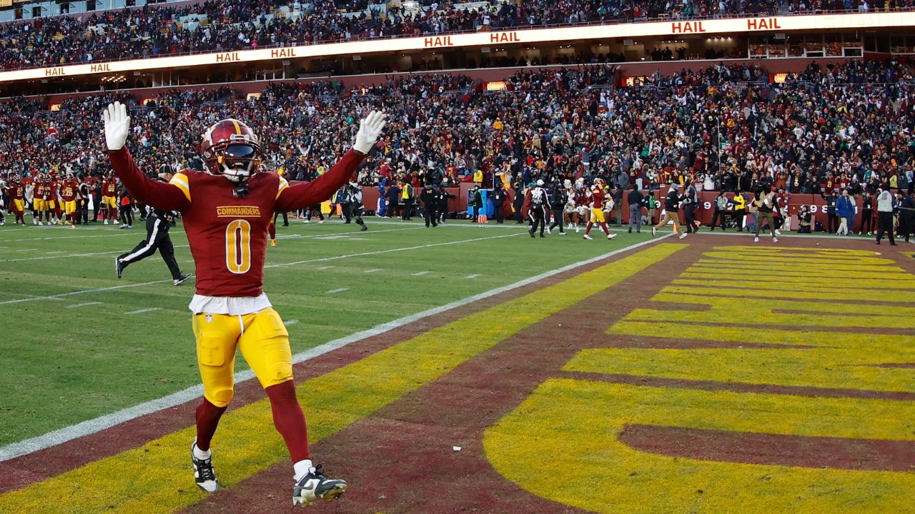 Washington Commanders cornerback Mike Sainristil (0) celebrates after the Commanders' game against the Philadelphia Eagles at Northwest Stadium.