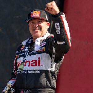 NHRA top fuel driver Tony Stewart celebrates after winning the Route 66 Nationals at Route 66 Raceway.
