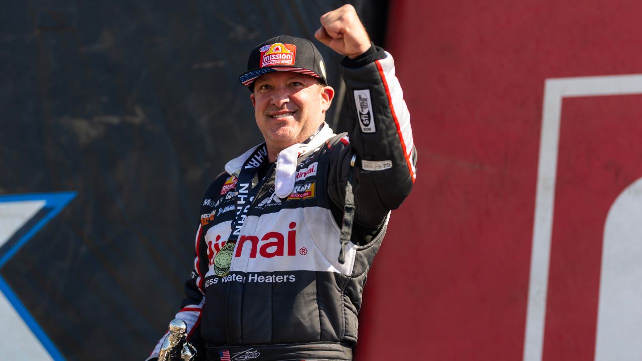NHRA top fuel driver Tony Stewart celebrates after winning the Route 66 Nationals at Route 66 Raceway.