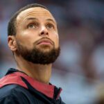 May 8, 2025; Minneapolis, Minnesota, USA; Golden State Warriors guard Stephen Curry (30) looks on from the bench against the Minnesota Timberwolves in the second half during game two of the second round for the 2025 NBA Playoffs at Target Center. Mandatory Credit: Jesse Johnson-Imagn Images