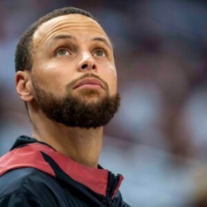 May 8, 2025; Minneapolis, Minnesota, USA; Golden State Warriors guard Stephen Curry (30) looks on from the bench against the Minnesota Timberwolves in the second half during game two of the second round for the 2025 NBA Playoffs at Target Center. Mandatory Credit: Jesse Johnson-Imagn Images