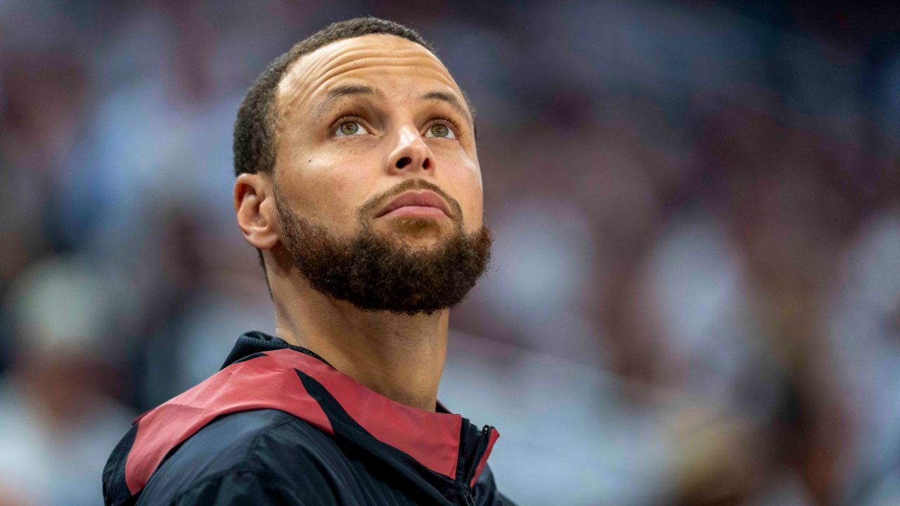 May 8, 2025; Minneapolis, Minnesota, USA; Golden State Warriors guard Stephen Curry (30) looks on from the bench against the Minnesota Timberwolves in the second half during game two of the second round for the 2025 NBA Playoffs at Target Center. Mandatory Credit: Jesse Johnson-Imagn Images