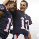 New England Patriots quarterback Tom Brady (12) celebrates with wide receiver Matthew Slater (18) after defeating the Atlanta Falcons at Gillette Stadium.