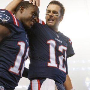 New England Patriots quarterback Tom Brady (12) celebrates with wide receiver Matthew Slater (18) after defeating the Atlanta Falcons at Gillette Stadium.