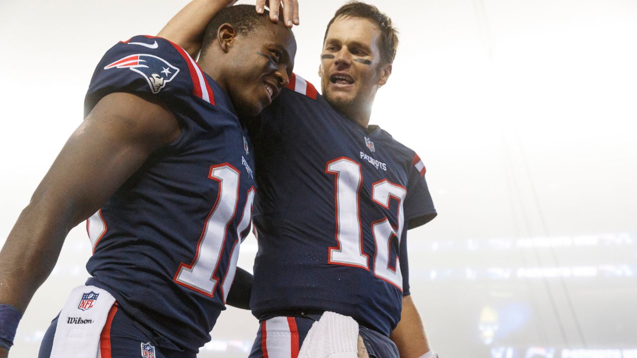 New England Patriots quarterback Tom Brady (12) celebrates with wide receiver Matthew Slater (18) after defeating the Atlanta Falcons at Gillette Stadium.